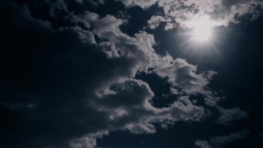 Fluffy clouds move across the sky