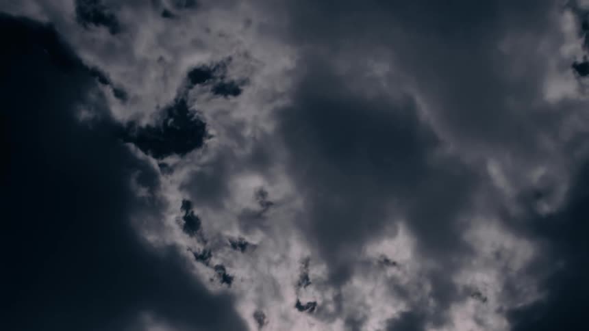 Fluffy clouds move across the sky