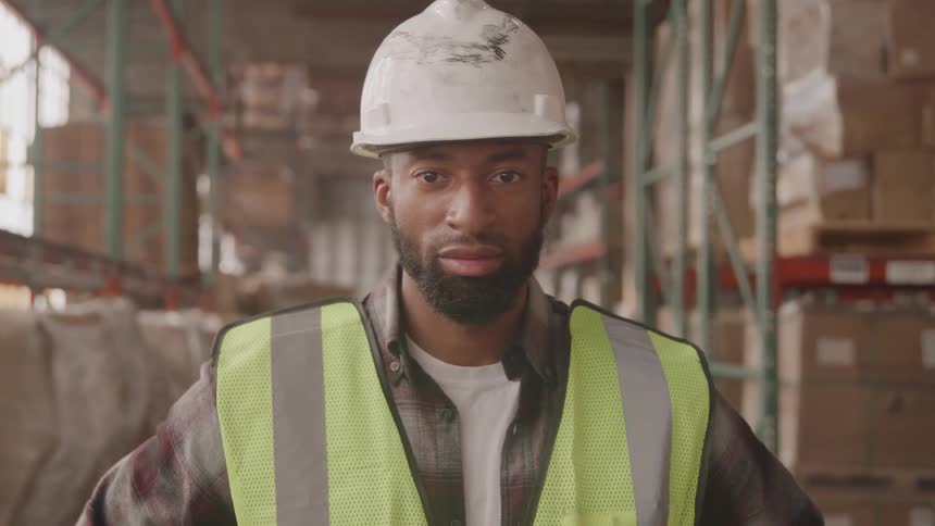 A worker looks at the camera