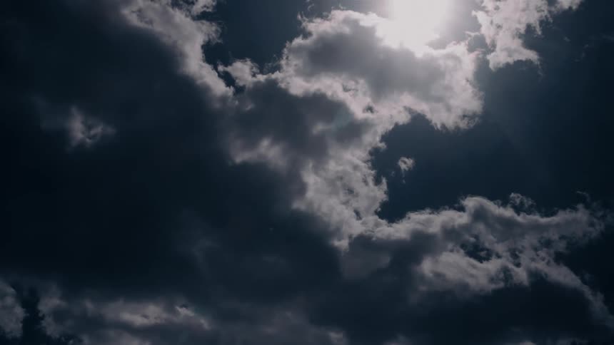 Fluffy clouds move across the sky