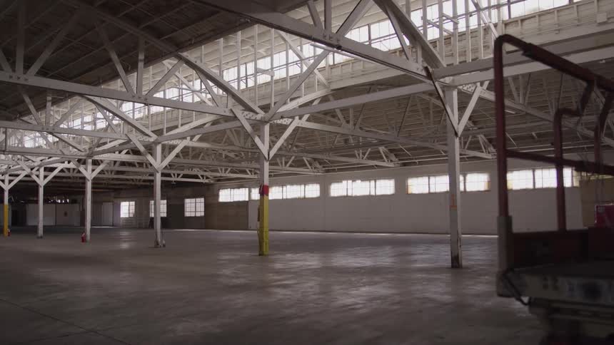 Interior of an empty warehouse with white beam structure