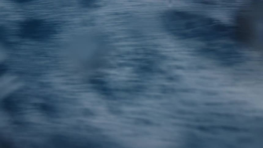 Blurred motion of seawater in a bluish tone