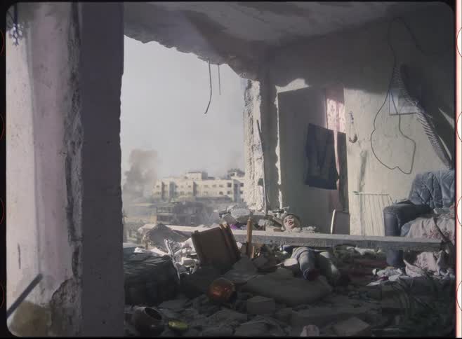 The building has been blown up and a child is under the rubble