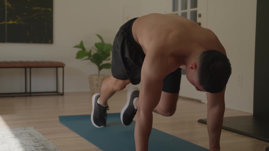 Man doing situps indoors