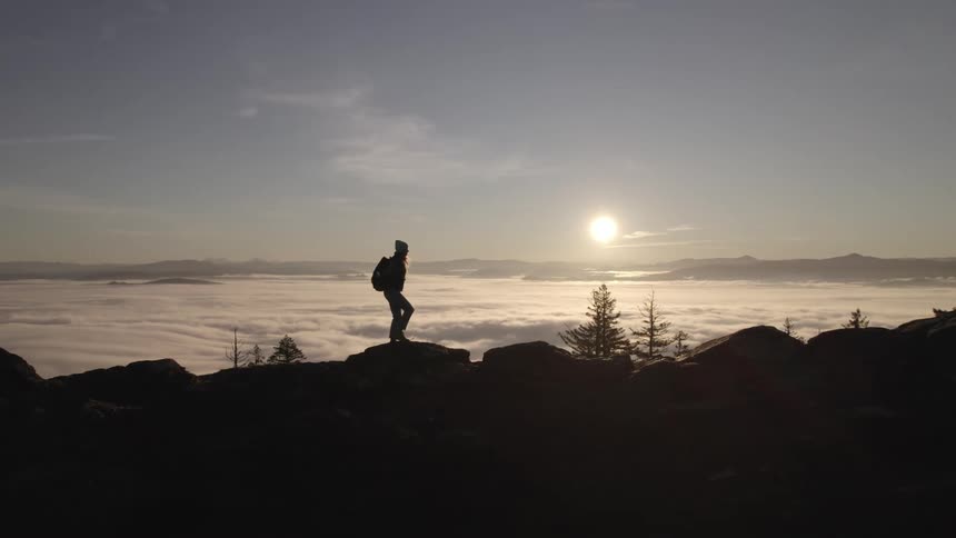A girl hikes across the land