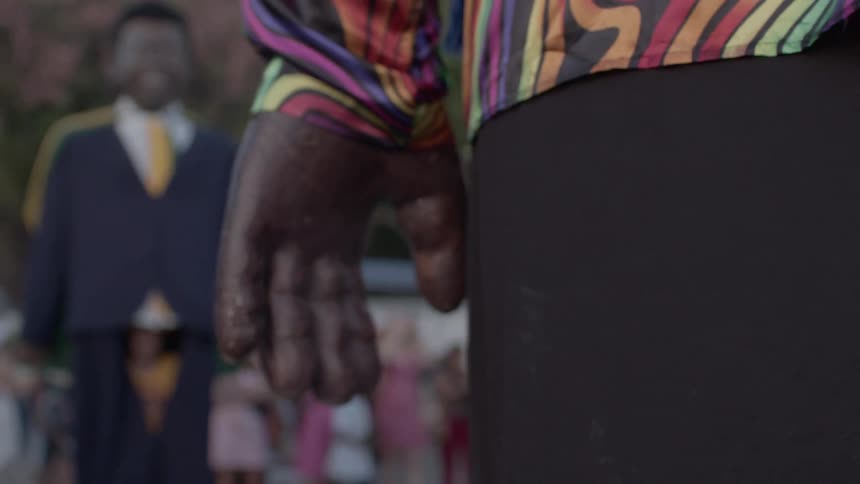Carnival giant puppet with blurred people in the background
