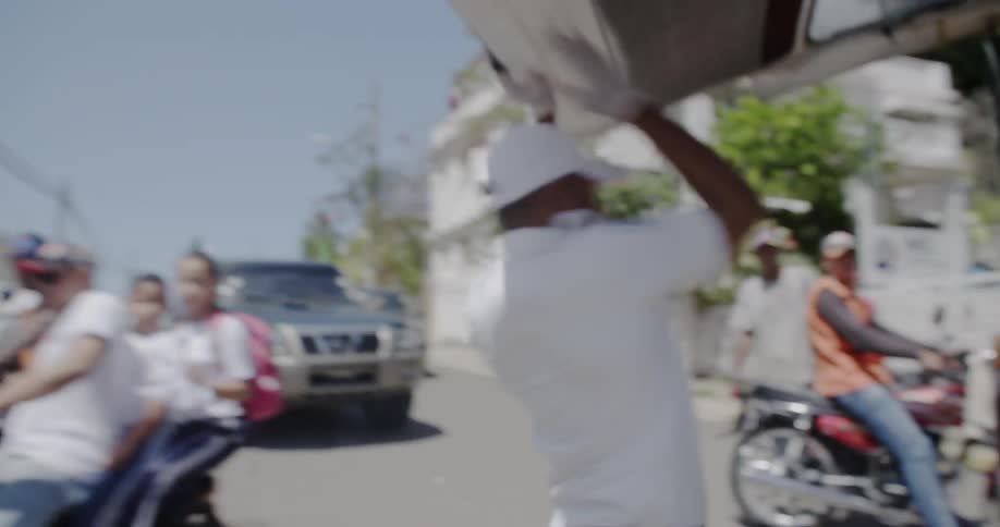 An ambulance worker hurries to open the back of his van