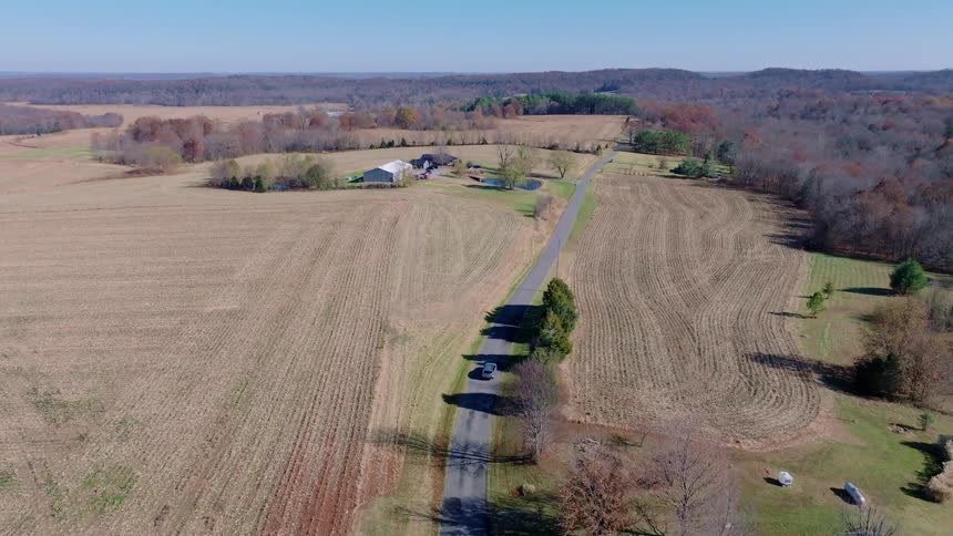 Aerial view of a rural neighborhood with houses and fields