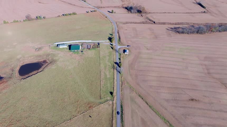 Aerial view of vast green landscape with intersecting roads