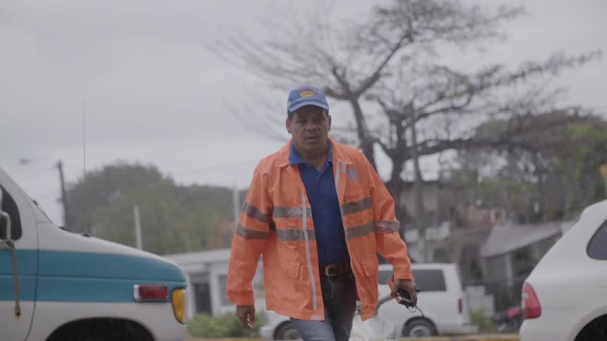Man walking from his work van on a fall day