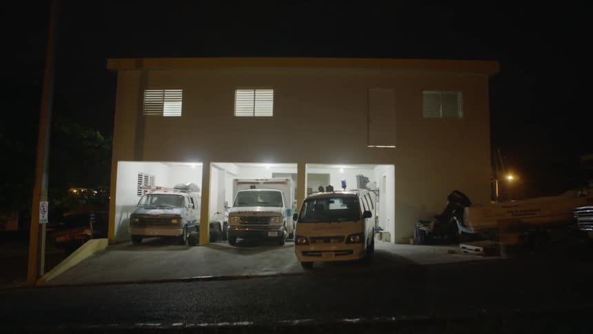 Three vans in a garage