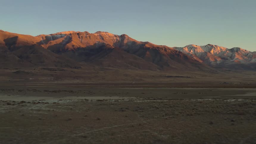 A desert plain near a mountain range