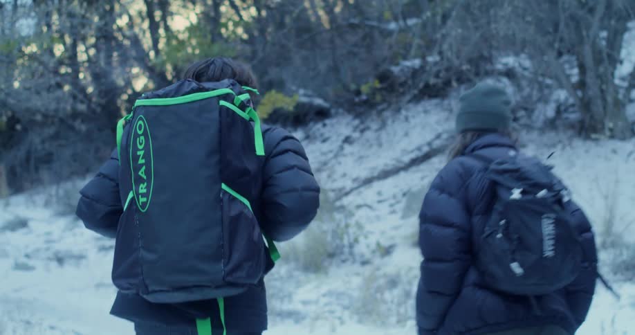 The couple close the car door and go hiking