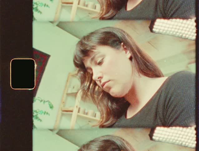 Woman with brown hair and concentrated bangs
