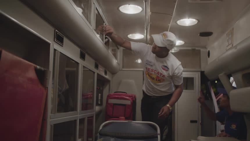 A paramedic stands in an ambulance