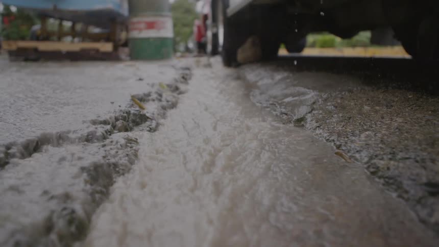 Rainwater flows down the road