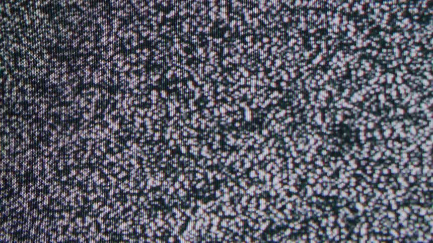 Screen displays black and white static noise with an irregular grainy pattern