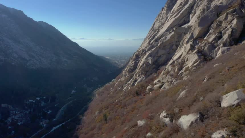 Aerial panorama of mountains against a blue sky with few clouds