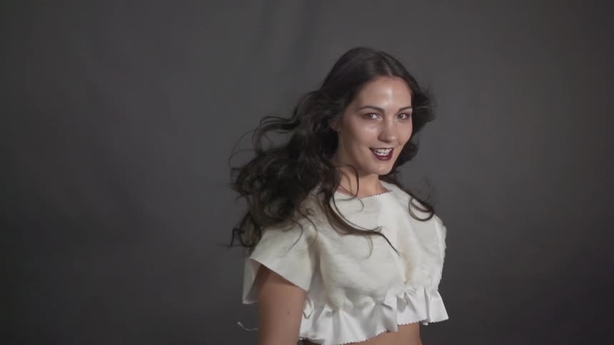 Woman smiling as she twirls around