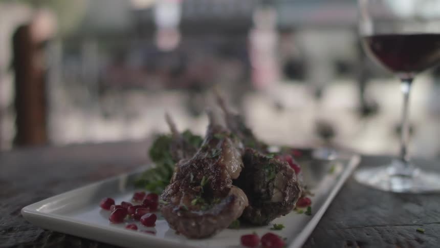 Food is served on a plate at a restaurant