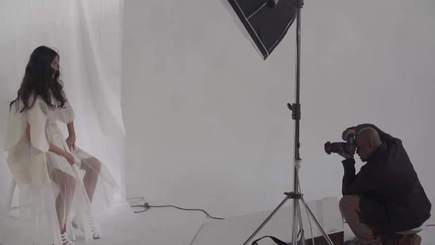 Woman having her picture taken in a photo shoot