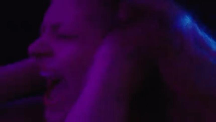 The woman holds her head and screams