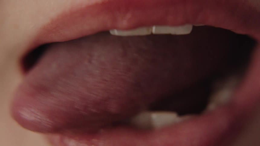 The person is moving their tongue back and forth