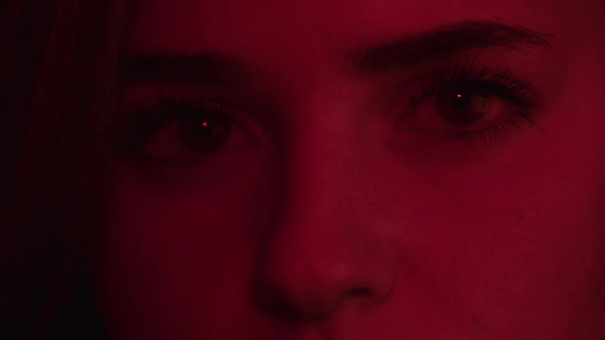 Intense gaze lit by red light