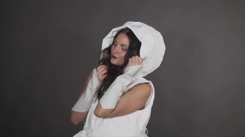 Woman models a white coat