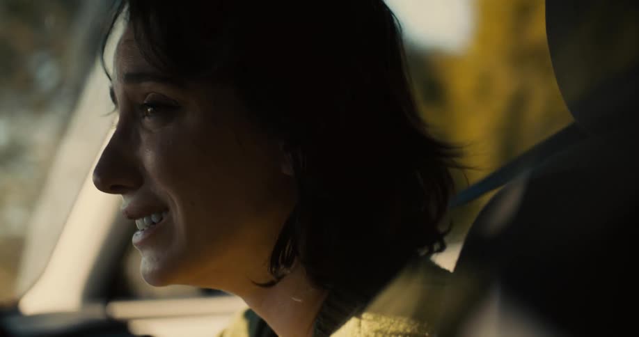 Emotional woman sitting inside a car