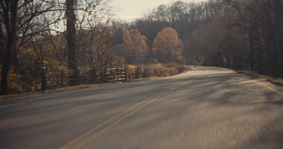 A man is cycling on the road