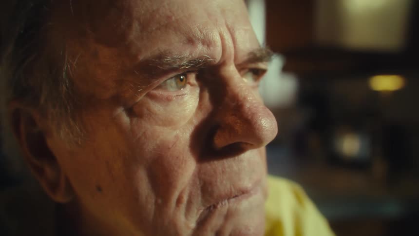 Closeup of an elderly mans face with a serious and focused look