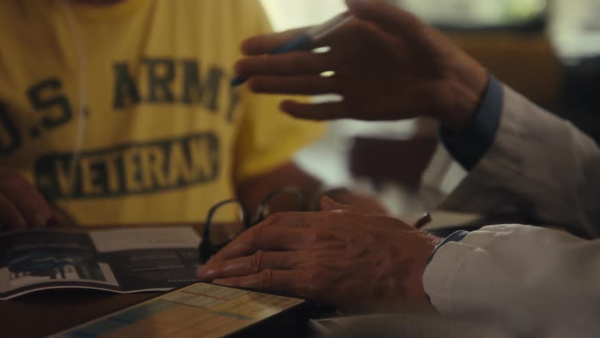 Doctors hands gesturing during conversation with a veteran