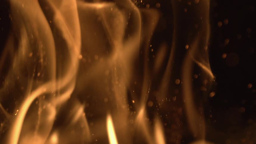 Golden flames swirl with sparks creating a warm and intense glow