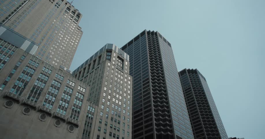 Skyscrapers seen from below against the blue sky