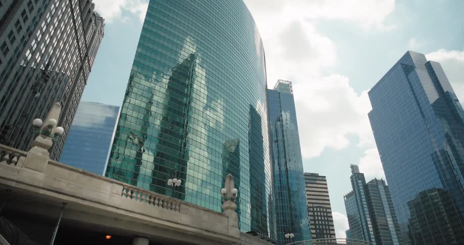 A city skyline with highrise buildings and skyscrapers at midday