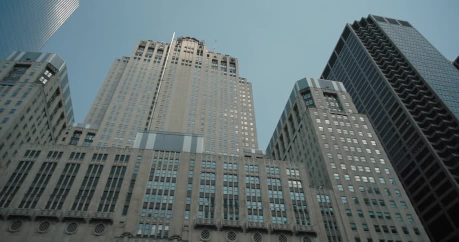 A city skyline with highrise buildings and skyscrapers at midday
