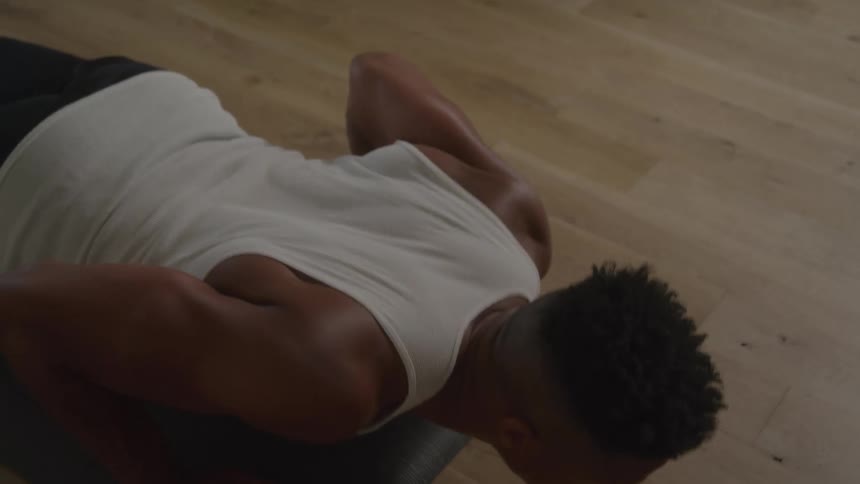 A man on the floor doing pushups