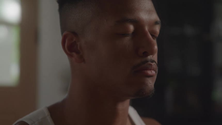 Man with closed eyes remains silent