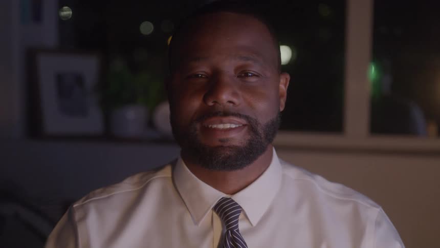 The office worker is smiling in the office at night