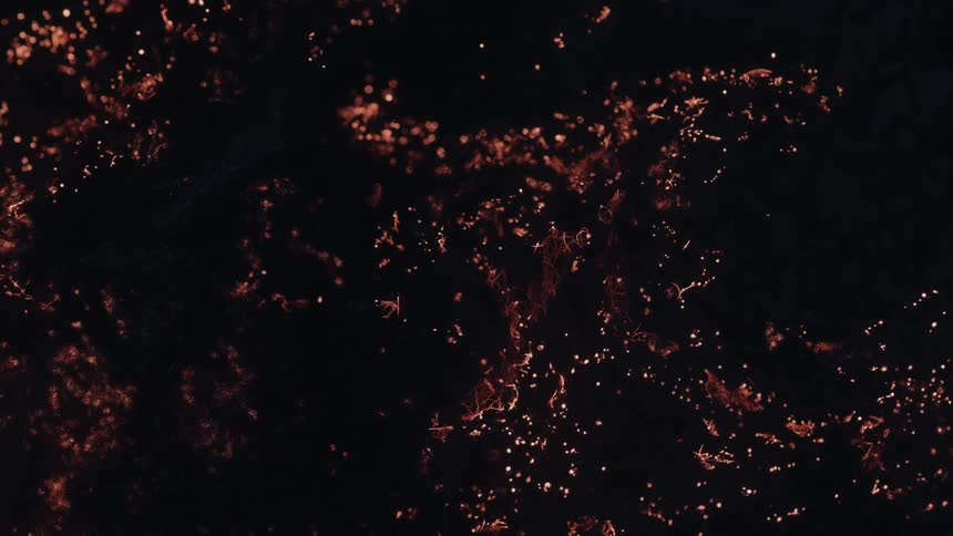 The tinder is giving off sparks as it burns