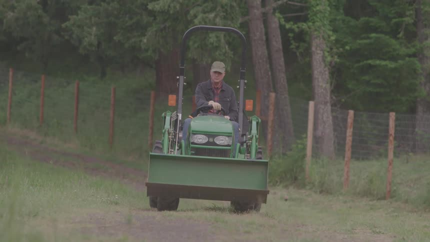 A man driving a tractor