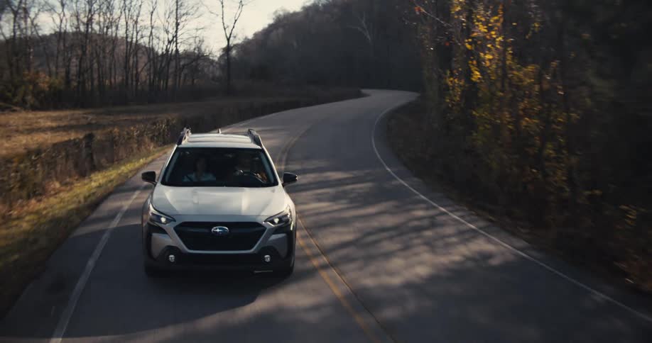 The silver car is on a road trip