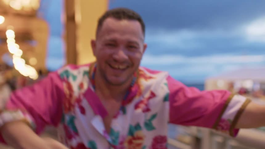 The man is dancing on the boardwalk