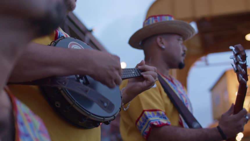 A band is performing on a cloudy day