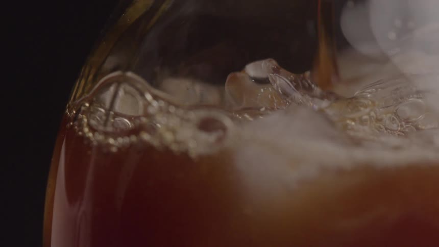 Soda is poured into a glass