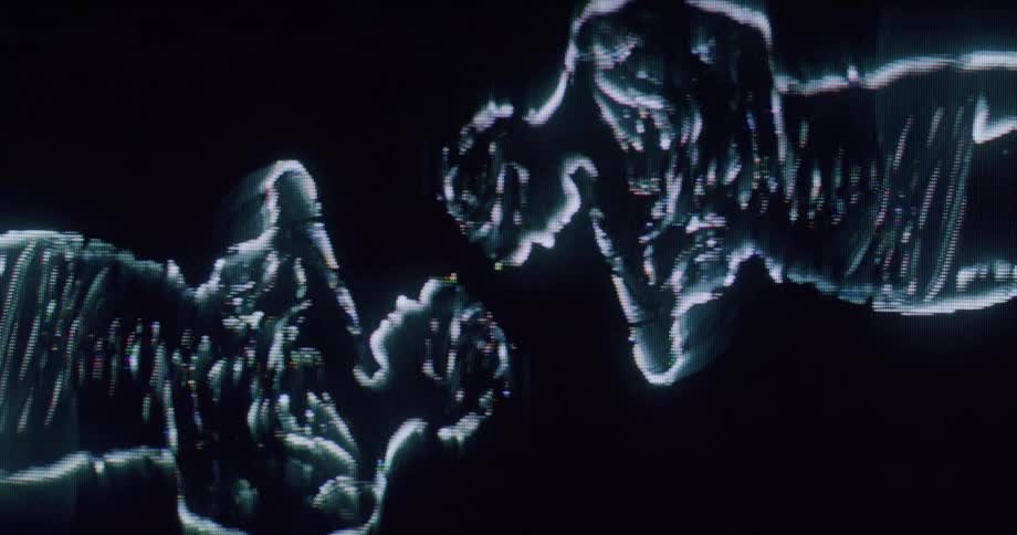 A digital hologram shows two icons of women dancing
