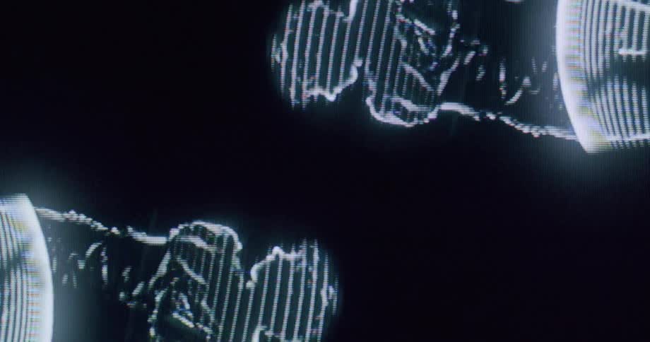 Two women side by side dance in the hologram artwork