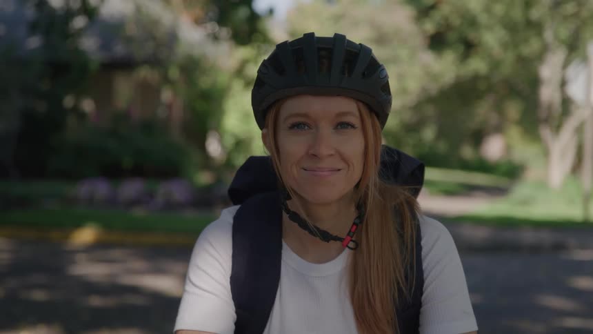 A woman is on a bike ride in the park