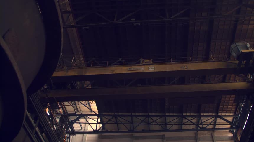 Elevated pedestrian walkway located near the ceiling crosses over part offactory